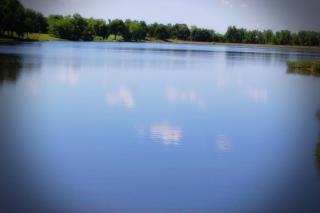 Osawatomie City Lake, clouds reflecting off the water